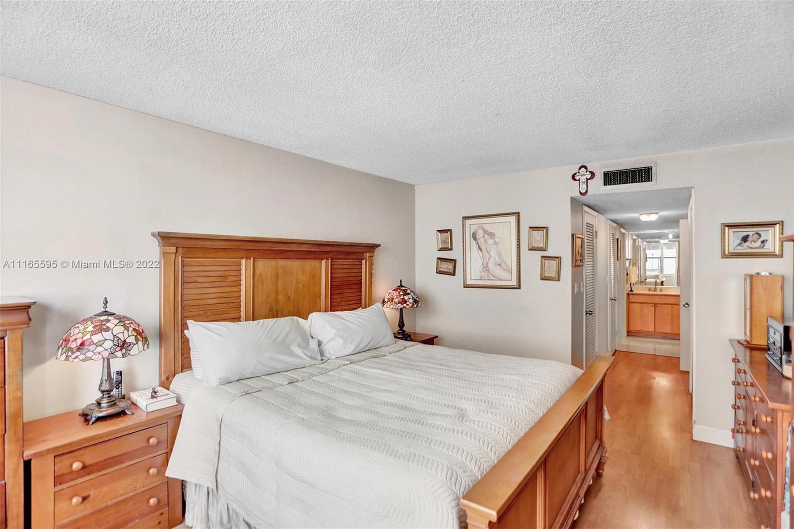 Millionaire's Row Miami Beach, FL 33140 - Photo 34 of 41 a bedroom with a large bed and a dresser