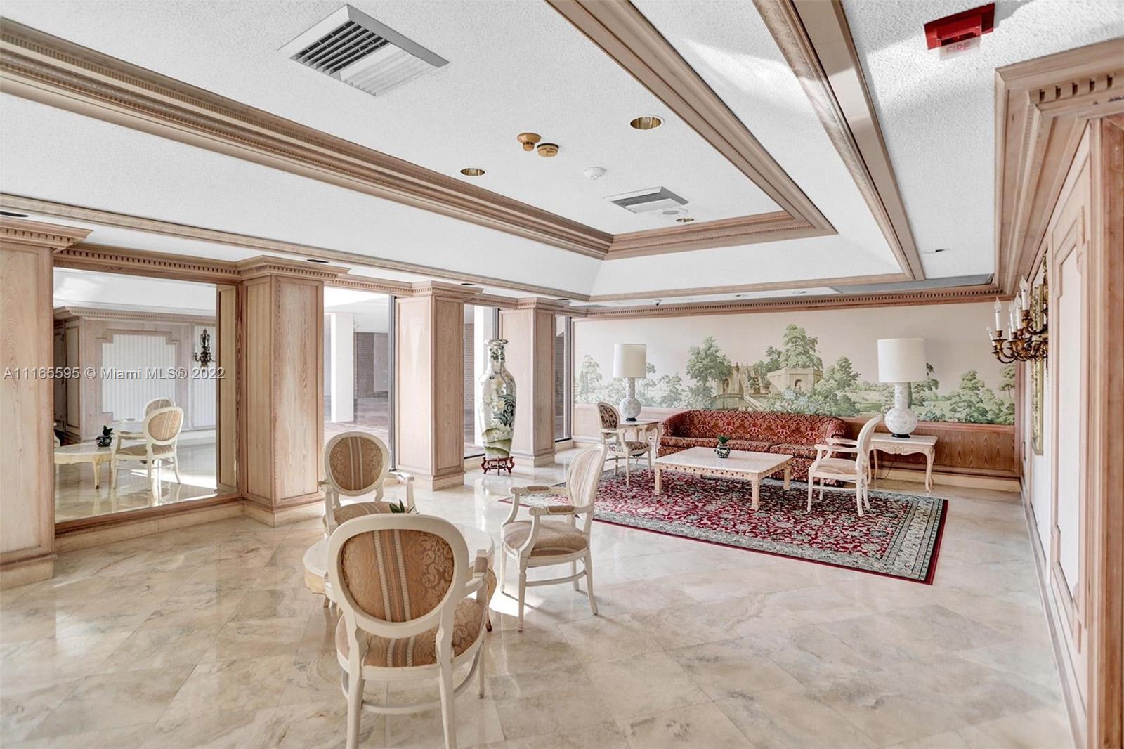 Millionaire's Row Miami Beach, FL 33140 - Photo 39 of 41 a living room with furniture and a large window