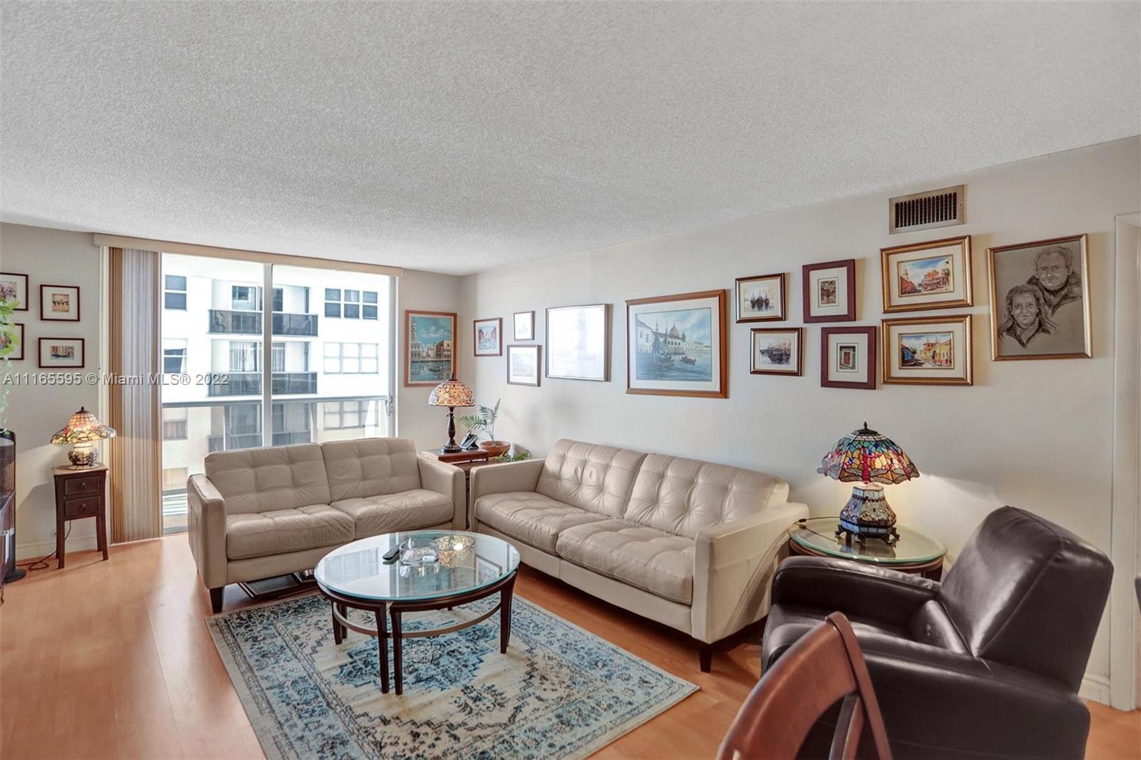 Millionaire's Row Miami Beach, FL 33140 - Photo 8 of 41 a living room with furniture a rug and a large window