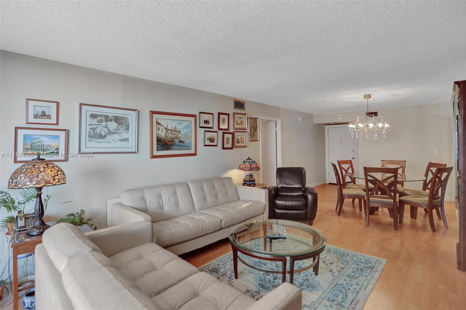 Millionaire's Row Miami Beach, FL 33140 - Photo 9 of 41 a living room with furniture and wooden floor