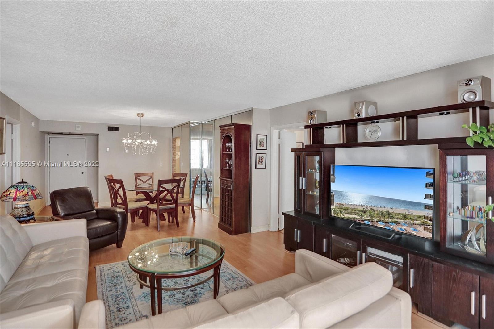 Millionaire's Row Miami Beach, FL 33140 - Photo 10 of 41 a living room with furniture a rug and a flat screen tv