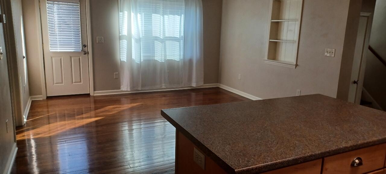 7673 Bent Mountain Road Roanoke, VA 24018 - Photo 6 of 10 an empty room with wooden floor and windows