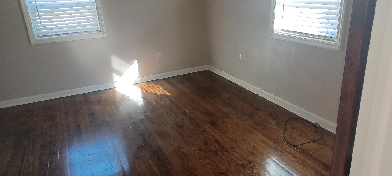 7673 Bent Mountain Road Roanoke, VA 24018 - Photo 7 of 10 a view of empty room with wooden floor and fan