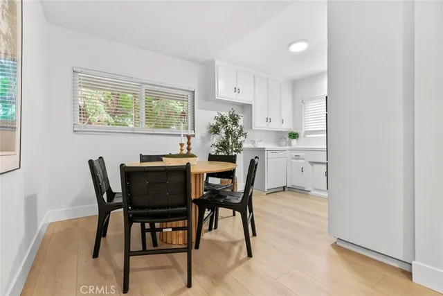 a view of a dining room with furniture and window