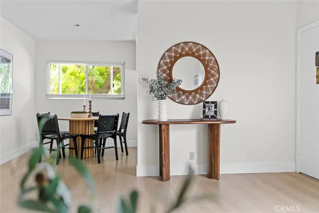 a view of a dining room with furniture and a window