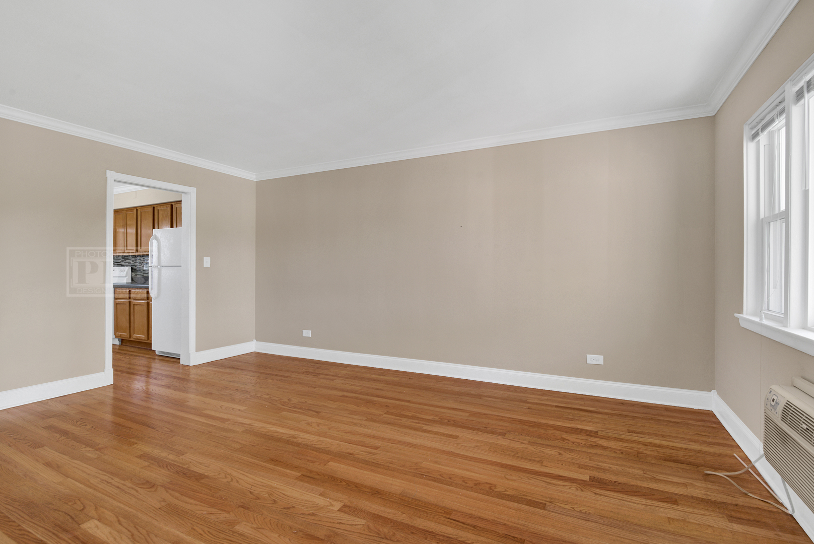 1427 Homestead Road, Unit G La Grange Park, IL 60526 - Photo 6 of 15 a view of an empty room with wooden floor and a window