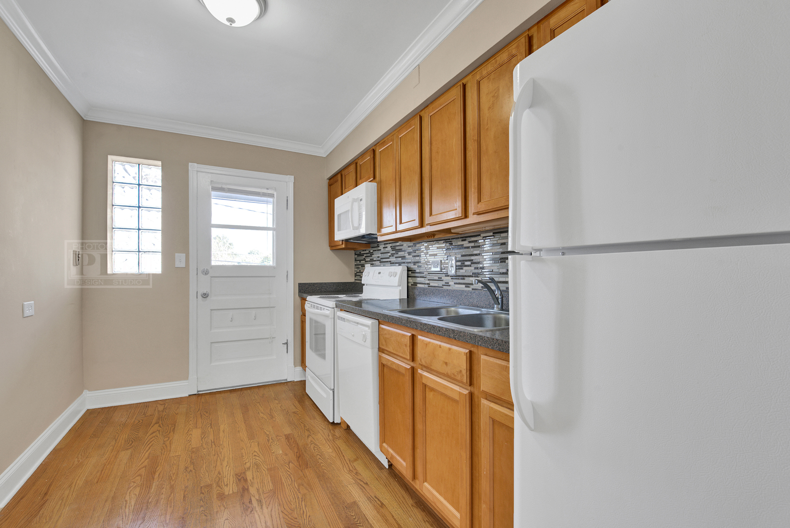 1427 Homestead Road, Unit G La Grange Park, IL 60526 - Photo 8 of 15 a kitchen with stainless steel appliances granite countertop a refrigerator sink and cabinets