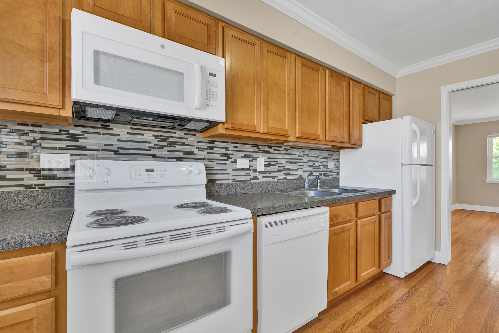 1427 Homestead Road, Unit G La Grange Park, IL 60526 - Photo 9 of 15 a kitchen with a stove cabinets and wooden floor