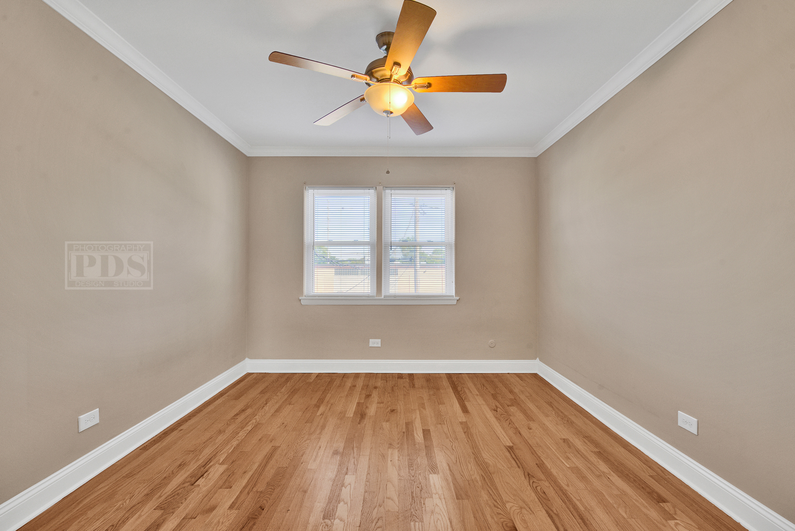 1427 Homestead Road, Unit G La Grange Park, IL 60526 - Photo 10 of 15 a view of empty room with wooden floor and fan