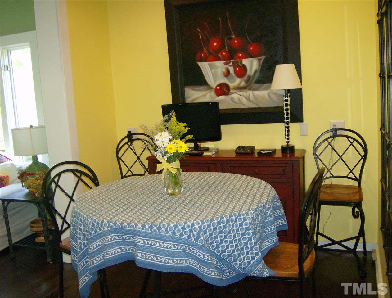 221 Forest Road Raleigh, NC 27605 - Photo 11 of 25 a bedroom with a bed and painting on the wall