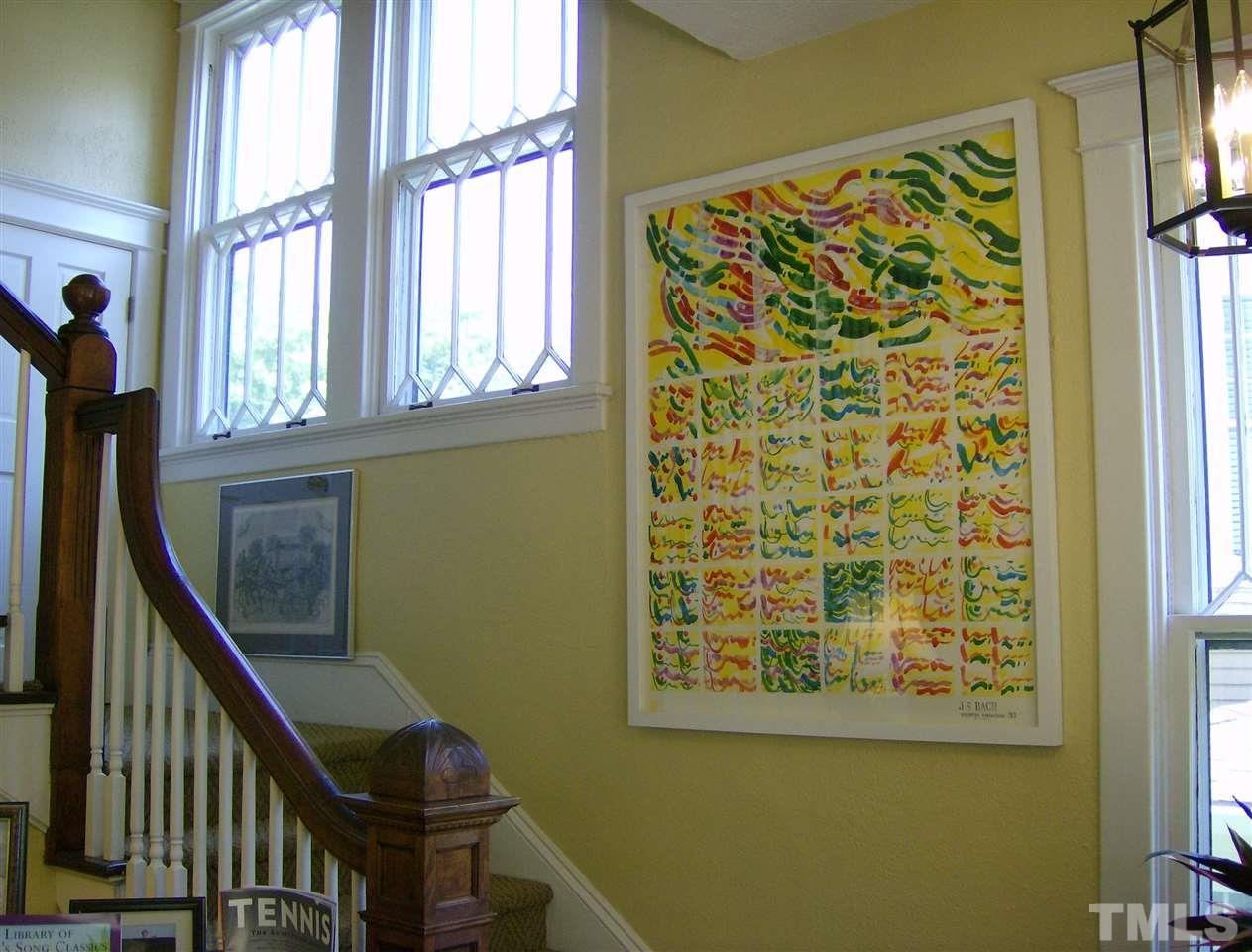 221 Forest Road Raleigh, NC 27605 - Photo 14 of 25 a view of entryway with a window and wooden floor