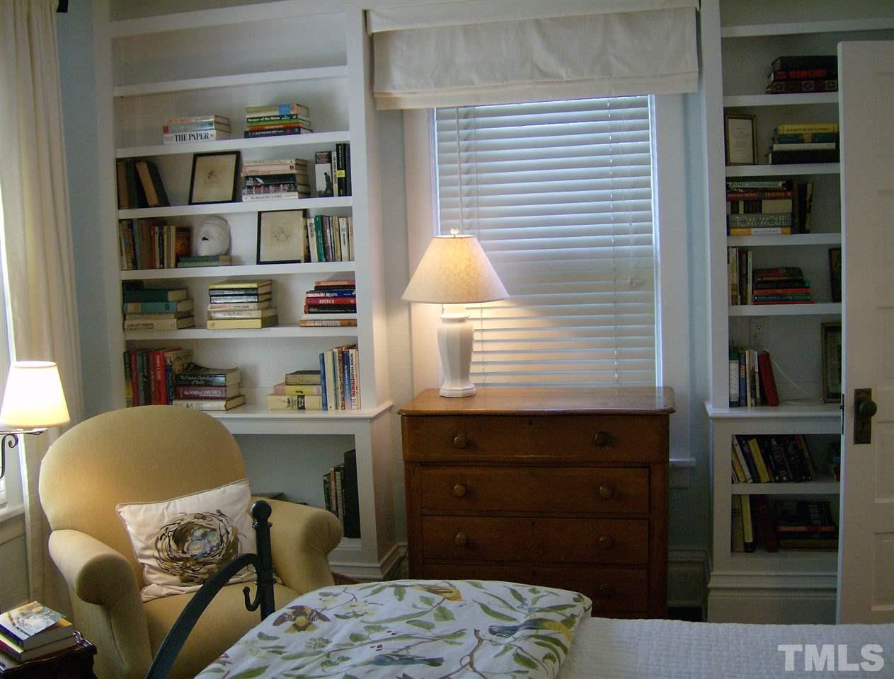 221 Forest Road Raleigh, NC 27605 - Photo 16 of 25 a room with a baby crib and a couch
