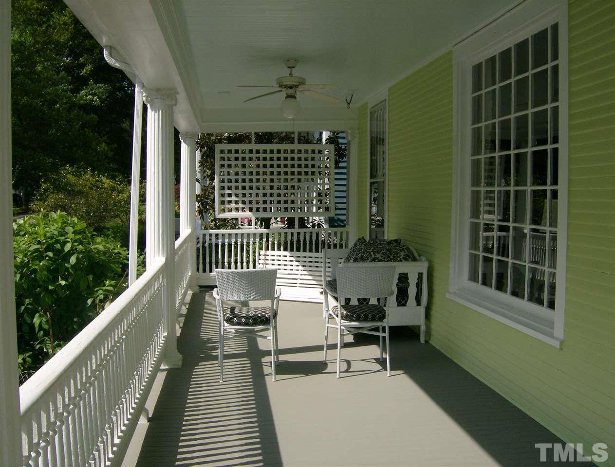 221 Forest Road Raleigh, NC 27605 - Photo 25 of 25 a balcony with wooden floor outdoor seating and stairs