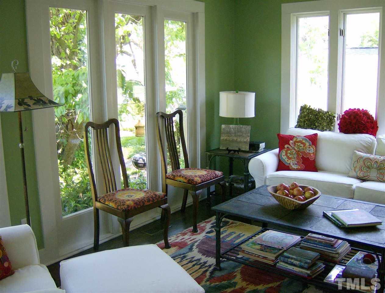 221 Forest Road Raleigh, NC 27605 - Photo 6 of 25 a living room with furniture and a large window