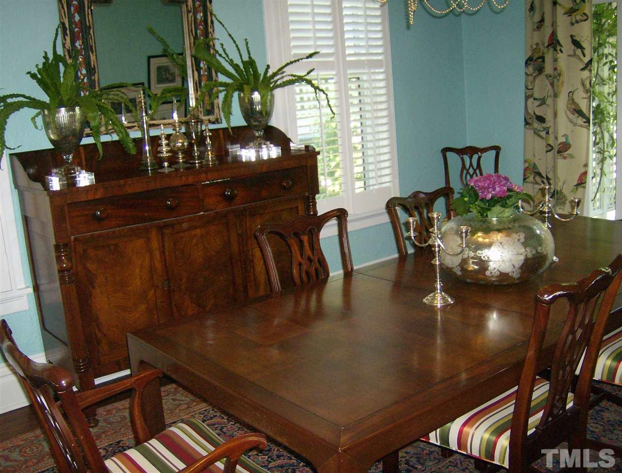 221 Forest Road Raleigh, NC 27605 - Photo 7 of 25 a view of a dining room with furniture and chandelier