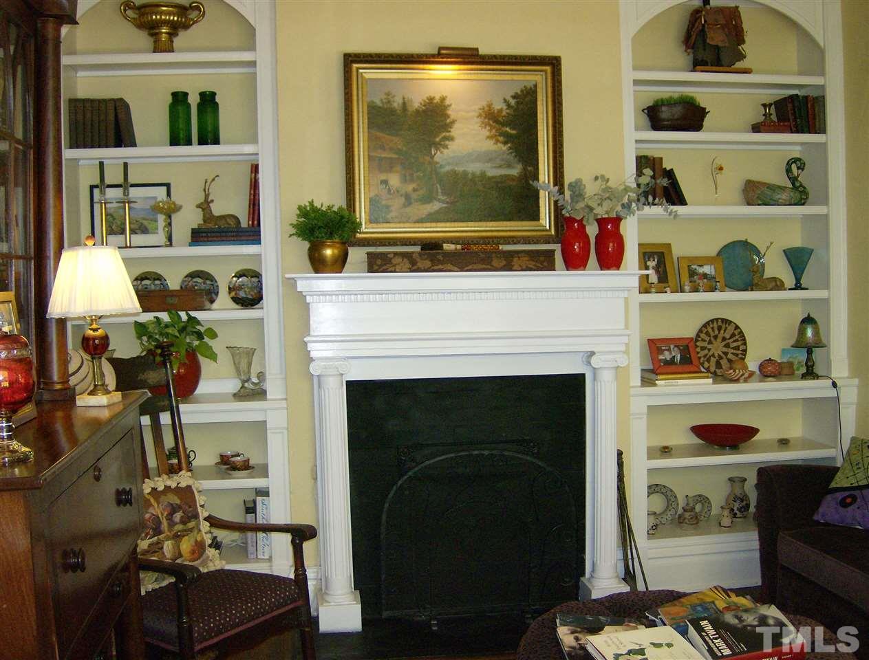 221 Forest Road Raleigh, NC 27605 - Photo 8 of 25 a living room with furniture and a fireplace