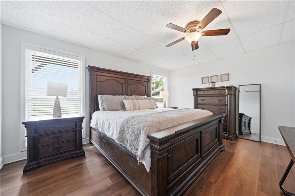97 Eagle Ridge Trail Cleveland, GA 30528 - Photo 56 of 58 a spacious bedroom with a bed and a ceiling fan