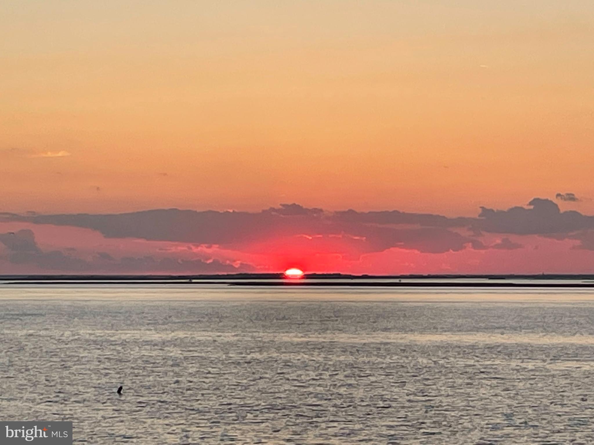24 Joan Road Long Beach Township, NJ 08008 - Photo 53 of 66 Serene sunset over tranquil waters.