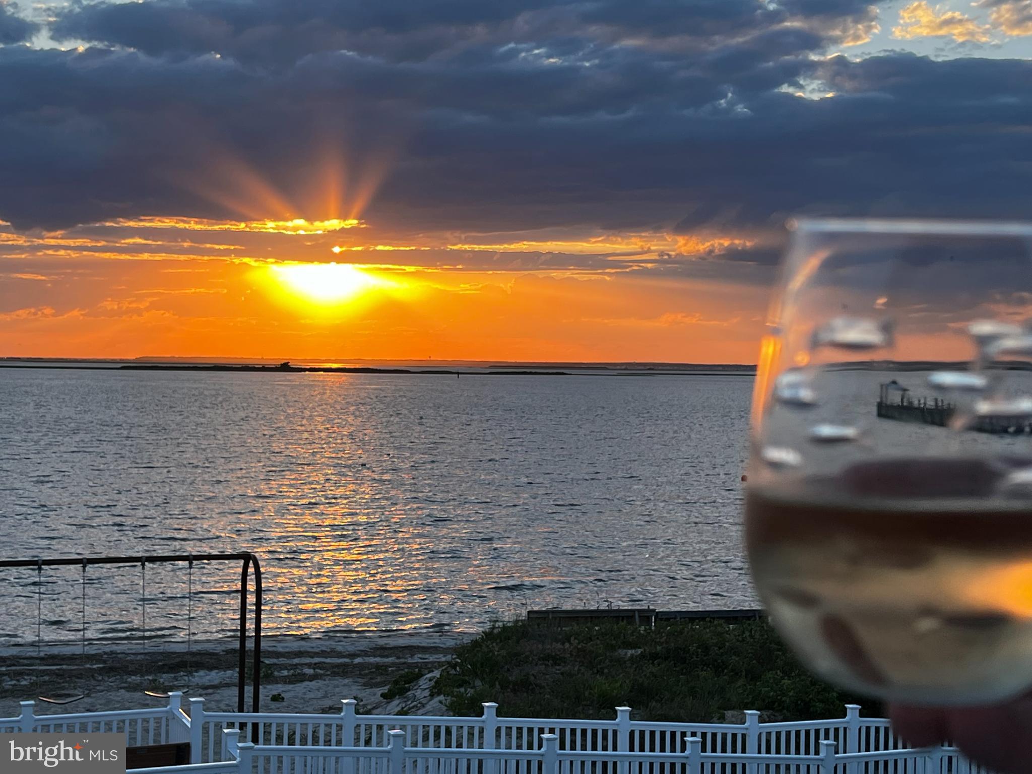 24 Joan Road Long Beach Township, NJ 08008 - Photo 58 of 66 Sunset Serenity with a Toast
