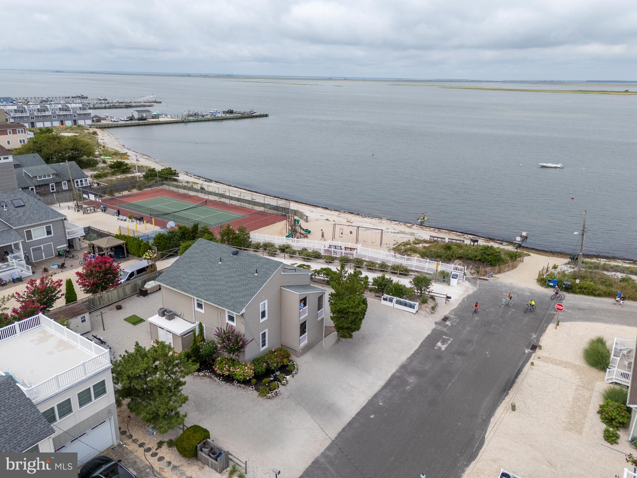 24 Joan Road Long Beach Township, NJ 08008 - Photo 8 of 66 an aerial view of a house with a yard and ocean view