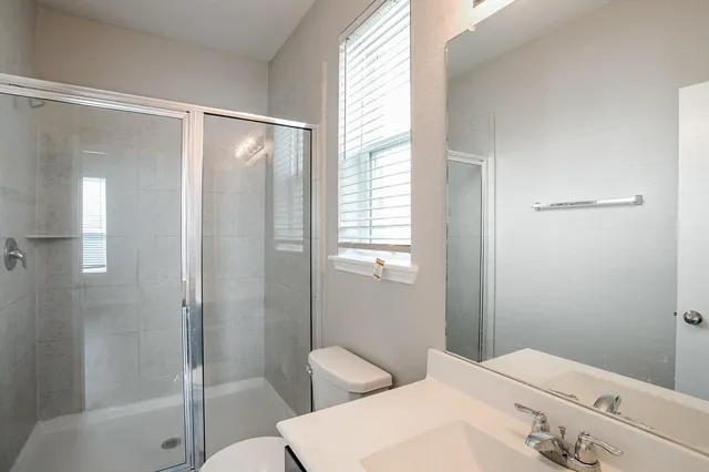 a bathroom with a sink and toilet
