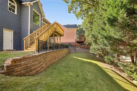a view of a house with swimming pool and sitting area