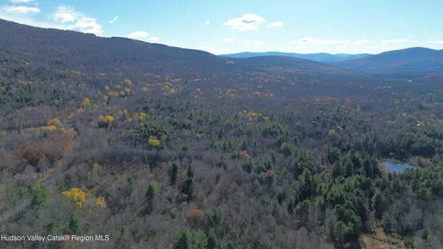 a view of mountains and valleys