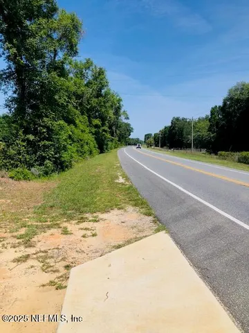 a view of a lake with houses in the background