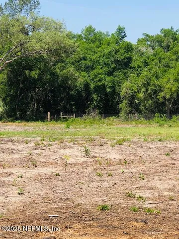a view of a lake and a yard
