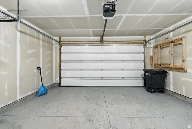 1221 West 1870 South Logan, UT 84321 - Photo 15 of 20 Attached garage featuring a white sectional door with automatic opener