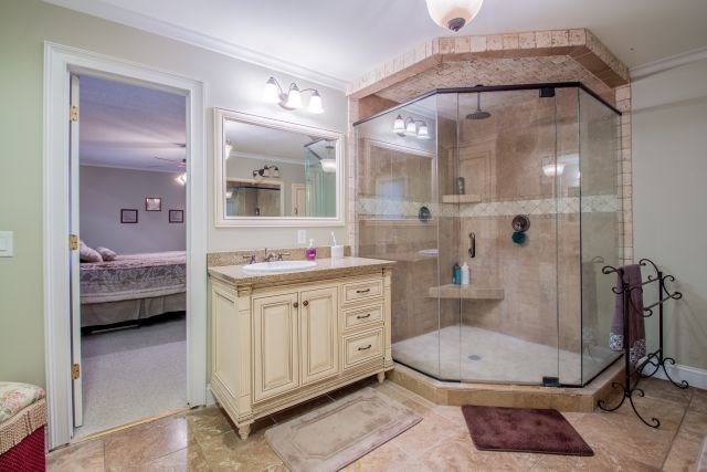 1630 Johnson Road Musella, GA 31066 - Photo 15 of 28 a spacious bathroom with a tub sink a mirror and shower
