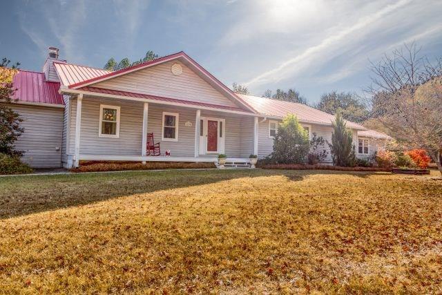 1630 Johnson Road Musella, GA 31066 - Photo 25 of 28 a front view of house with yard and trees in the background