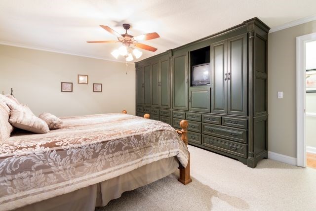 1630 Johnson Road Musella, GA 31066 - Photo 27 of 28 a bedroom with a bed and a chandelier