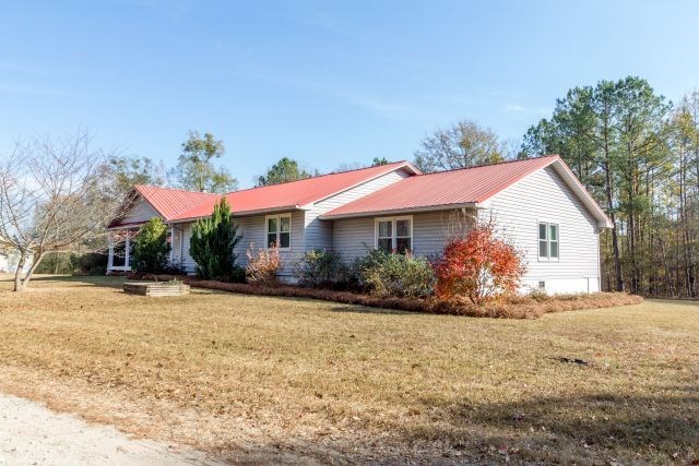 1630 Johnson Road Musella, GA 31066 - Photo 4 of 28 a front view of a house with a yard