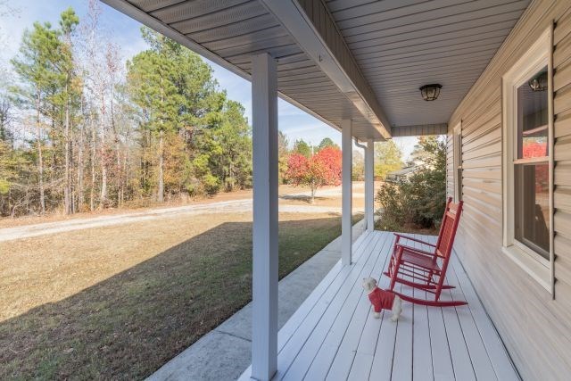 1630 Johnson Road Musella, GA 31066 - Photo 5 of 28 a view of two chairs in the balcony next to a yard