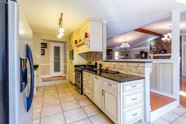 1630 Johnson Road Musella, GA 31066 - Photo 7 of 28 a kitchen with stainless steel appliances granite countertop a stove and a sink