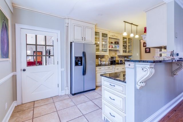 1630 Johnson Road Musella, GA 31066 - Photo 8 of 28 a kitchen with stainless steel appliances a refrigerator sink and cabinets