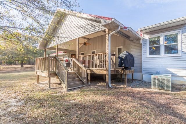 1630 Johnson Road Musella, GA 31066 - Photo 10 of 28 a view of a house with a patio and a yard