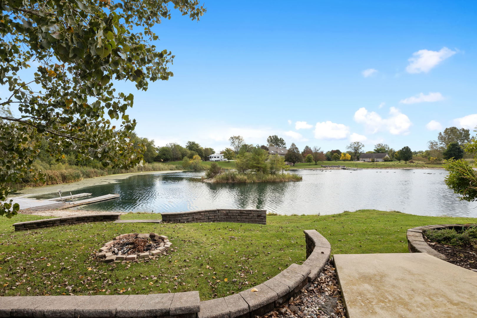2050 South Spencer Road New Lenox, IL 60451 - Photo 11 of 33 a view of a lake with a house in the background