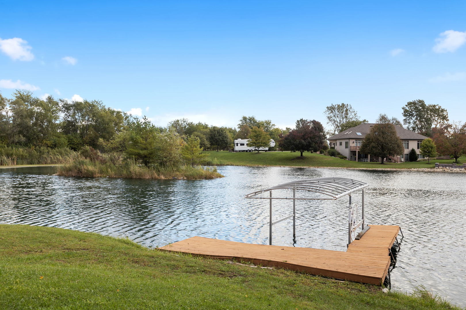 2050 South Spencer Road New Lenox, IL 60451 - Photo 12 of 33 a view of a lake with houses in the background