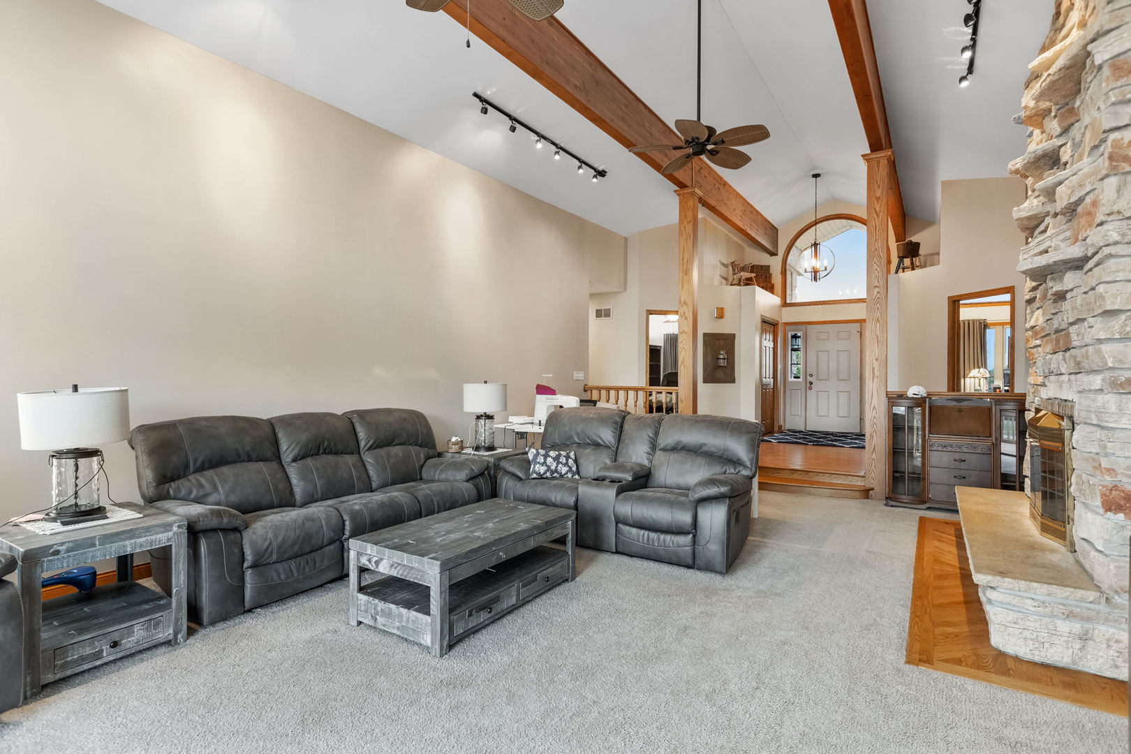 2050 South Spencer Road New Lenox, IL 60451 - Photo 16 of 33 a living room with furniture and a chandelier