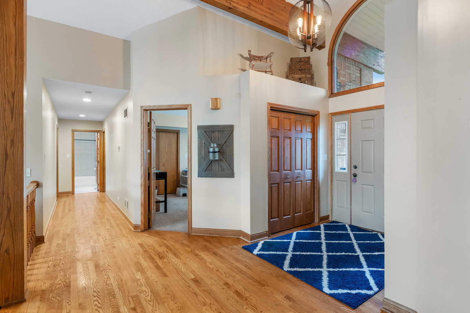 2050 South Spencer Road New Lenox, IL 60451 - Photo 17 of 33 a view of an empty room with wooden floor and a bathroom