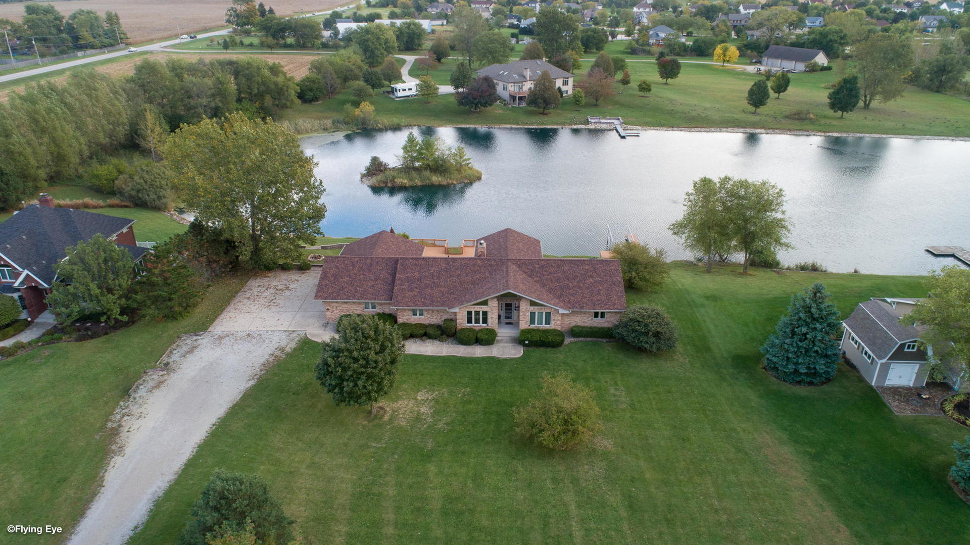 2050 South Spencer Road New Lenox, IL 60451 - Photo 3 of 33 an aerial view of residential houses with outdoor space and lake view