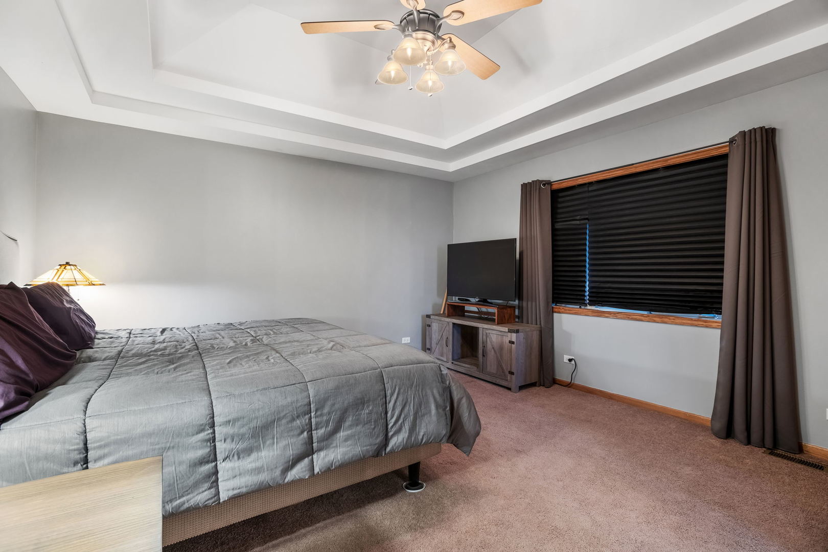 2050 South Spencer Road New Lenox, IL 60451 - Photo 22 of 33 a bedroom with a bed and a flat screen tv