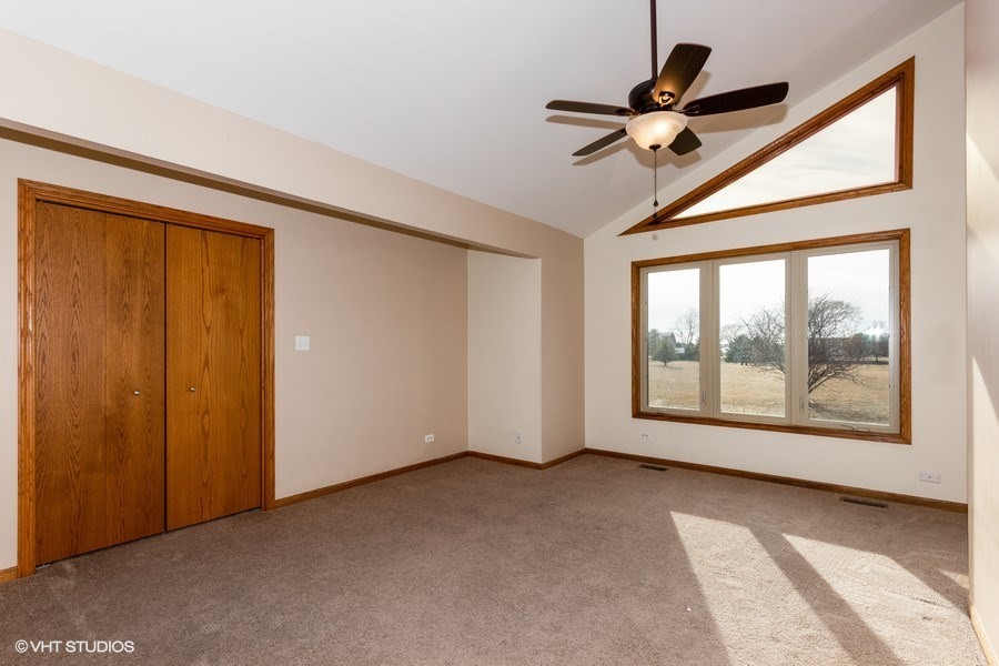 2050 South Spencer Road New Lenox, IL 60451 - Photo 27 of 33 a view of room with a ceiling fan and window