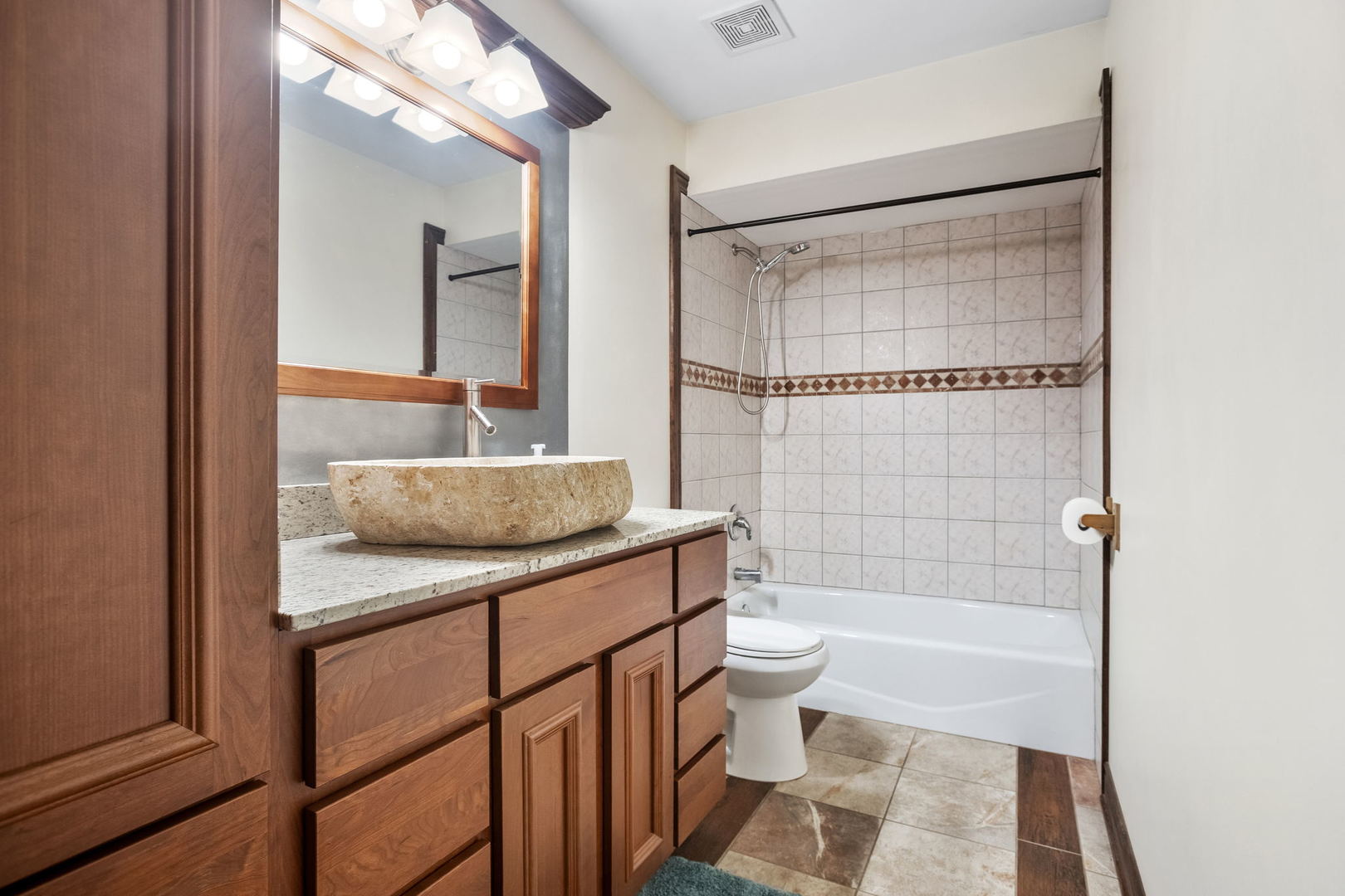 2050 South Spencer Road New Lenox, IL 60451 - Photo 28 of 33 a bathroom with a sink a toilet a mirror and shower