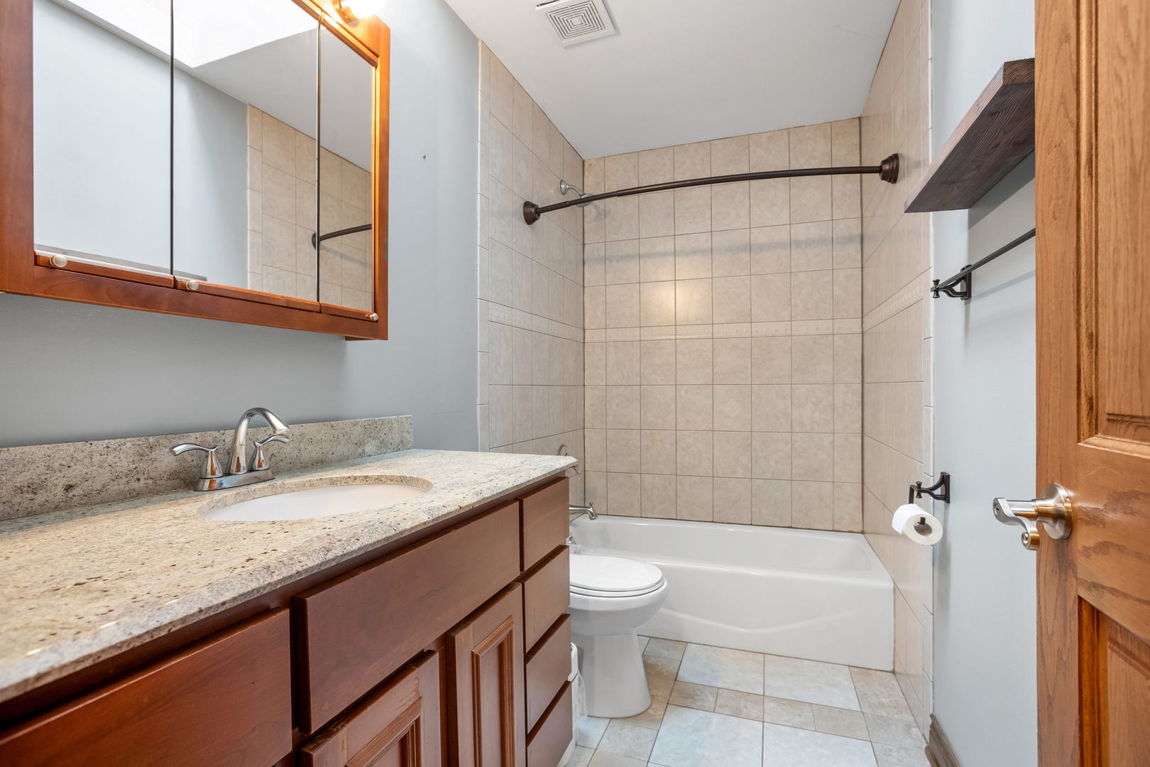 2050 South Spencer Road New Lenox, IL 60451 - Photo 29 of 33 a bathroom with a granite countertop sink a toilet and bathtub