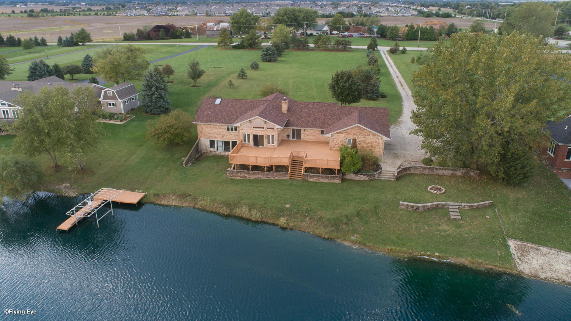 2050 South Spencer Road New Lenox, IL 60451 - Photo 8 of 33 an aerial view of a house with a garden and lake view
