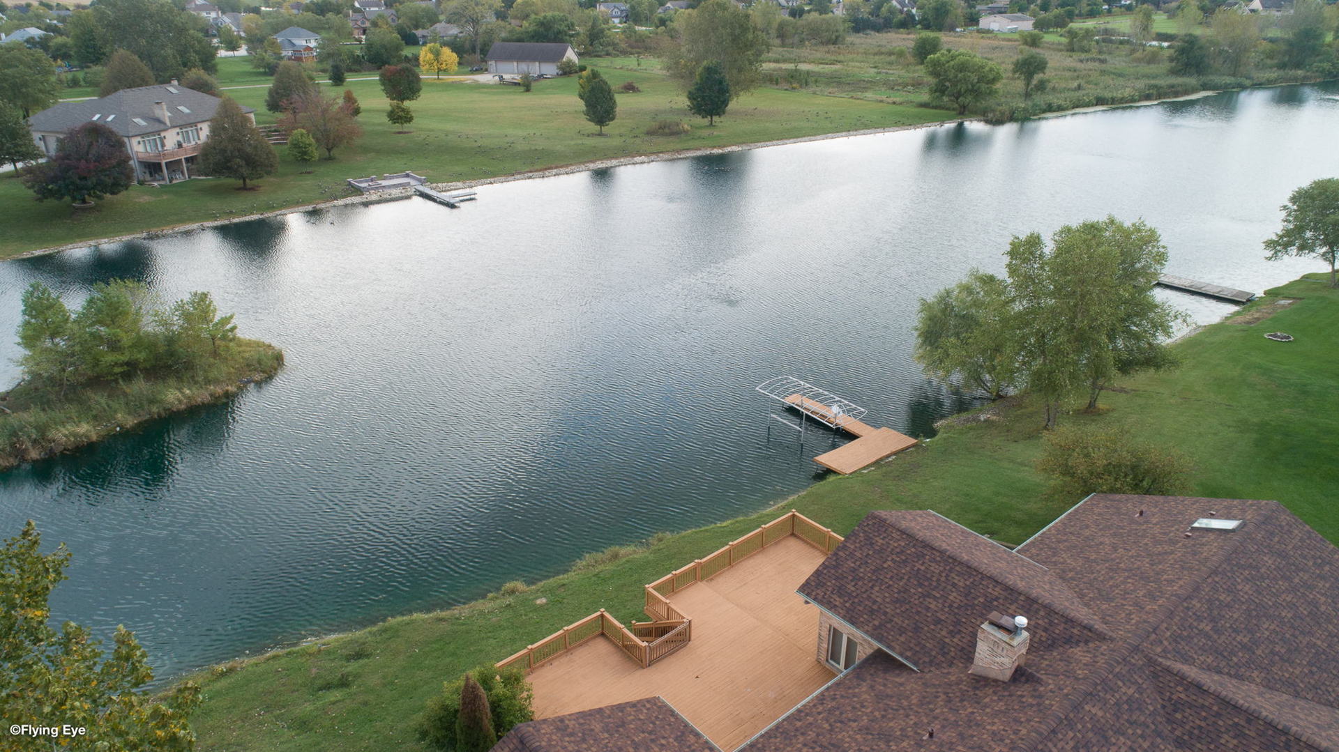 2050 South Spencer Road New Lenox, IL 60451 - Photo 9 of 33 an aerial view of a house with a yard and lake view