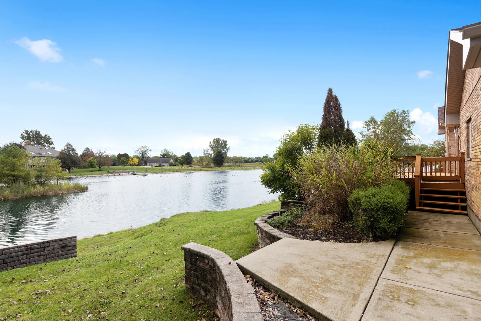 2050 South Spencer Road New Lenox, IL 60451 - Photo 10 of 33 a view of a lake with couches and wooden floor